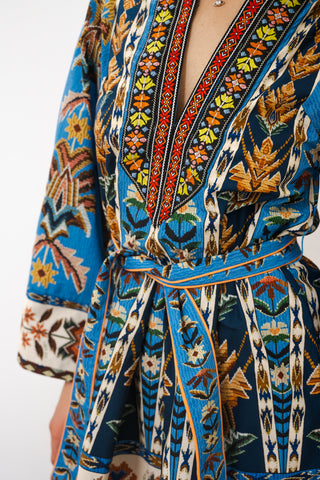 Close-up of a colorful patterned garment with a belt