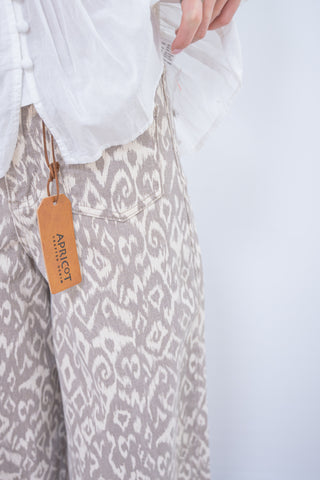 Patterned apron with a brand tag on a white background